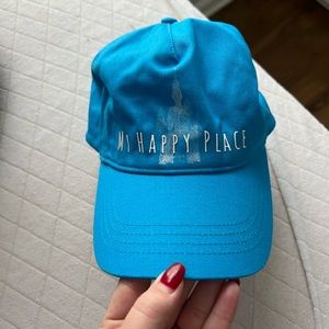 Disney hat that says "my happy place" with castle